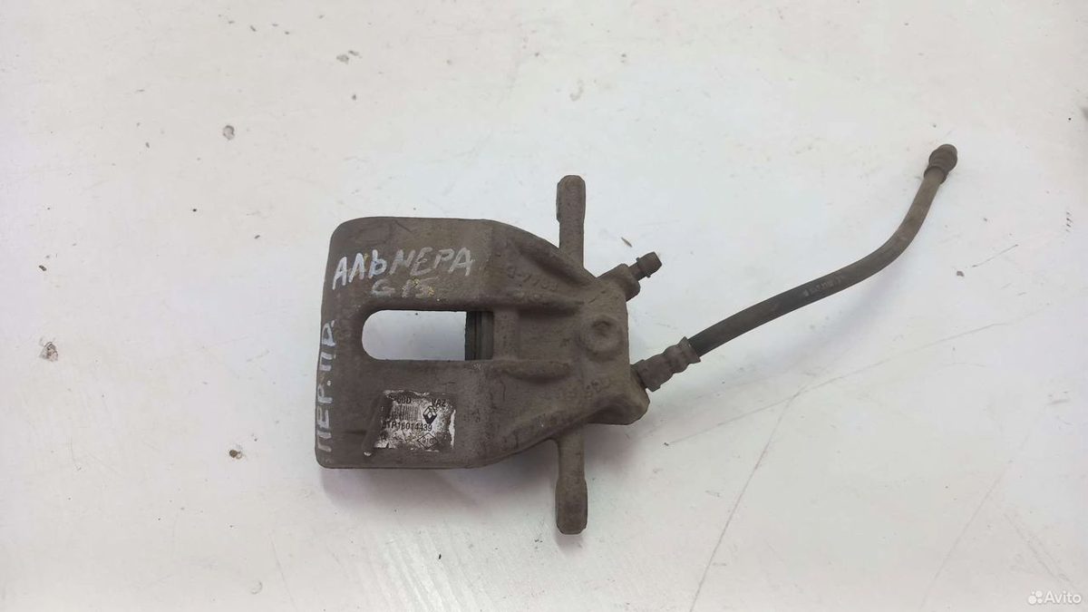 Суппорт передний правый Nissan Almera G15